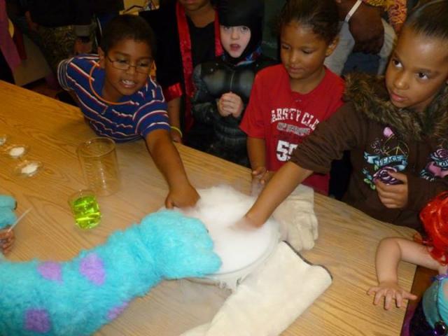 Kids participate in hands on experiments at last year's magic show.